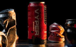 black and red vyper energy can standing tall amongst crushed cans of competitors