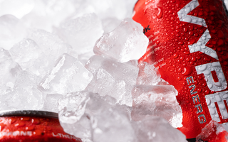 Red and white Vyper Energy cans laying in ice cubes