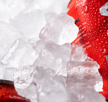 Red and white Vyper Energy cans laying in ice cubes