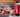 Red and black vyper energy can on kitchen counter with bowl of fruit, measuring cup, and knives